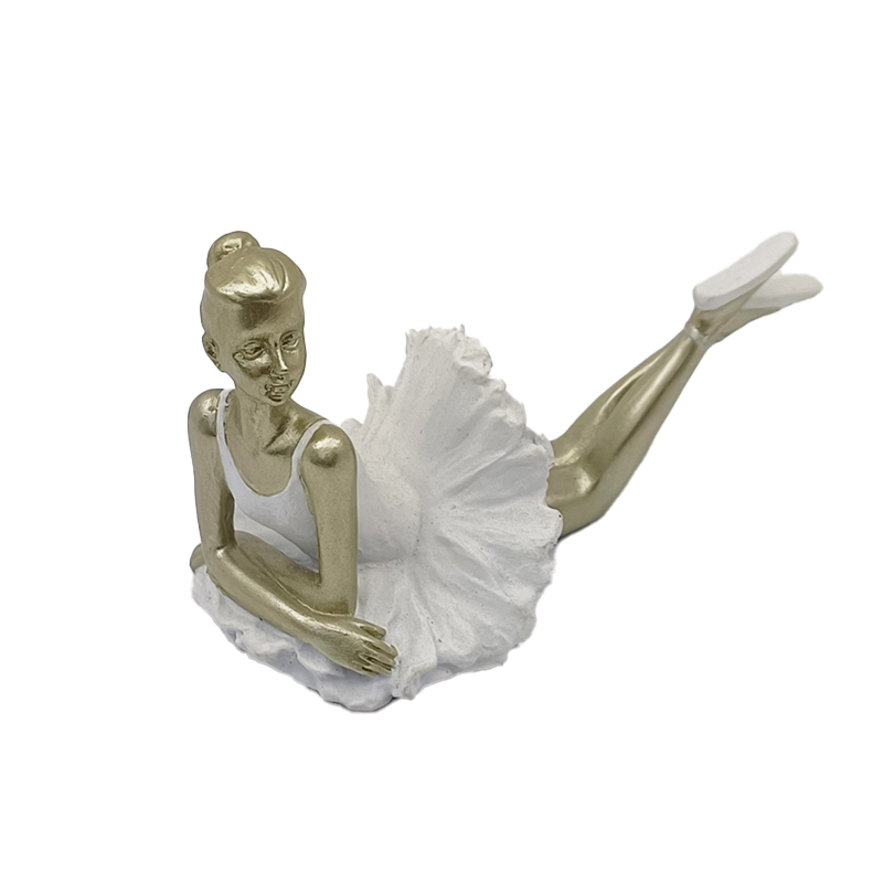 Resin figurine of a ballet dancer in a white dress with gold accents